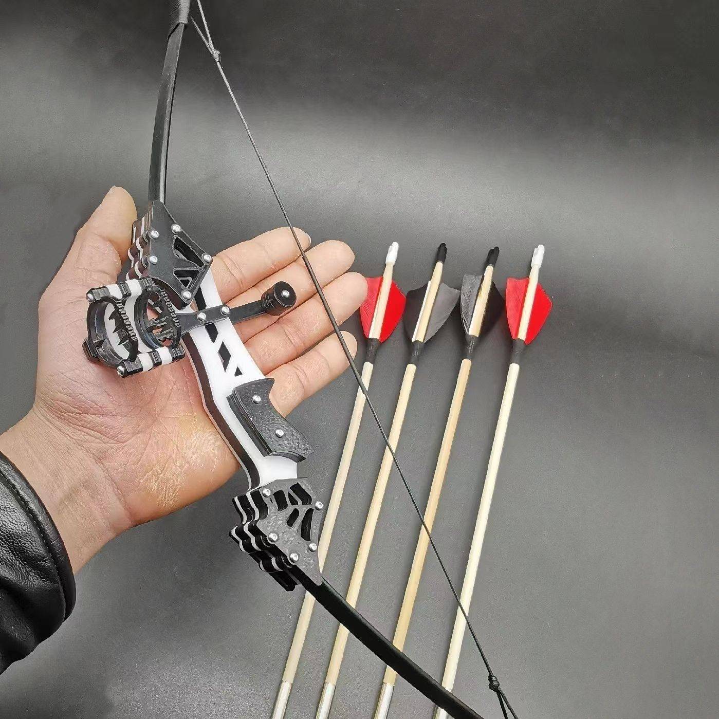 A generation of hard plastics with bows + 4 arrows + target paper + wrench